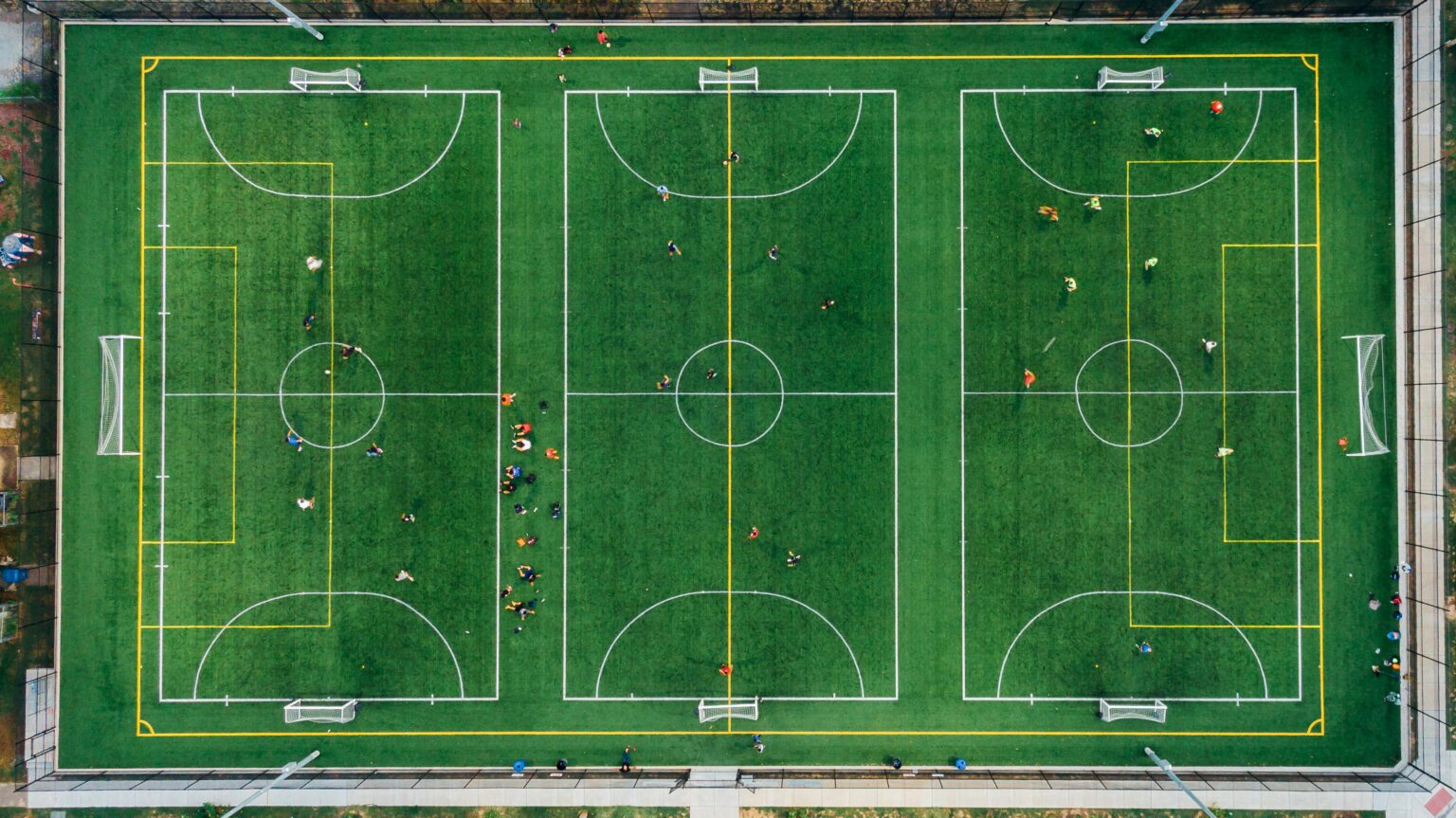 Aerial photo capturing an active soccer game on a sports field in Chattanooga.